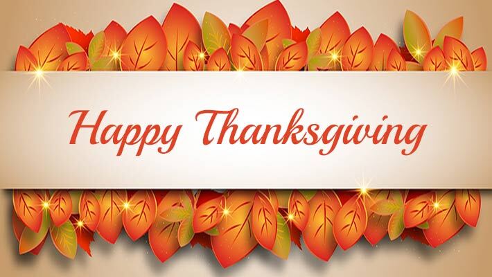 Leaves behind a banner that has the text Happy Thanksgiving.