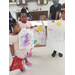 Three children posing with their posters.