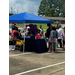 A gathering of people getting school supplies.