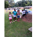 A group of kids outside at the Back to School Bash for the Enfield Community.