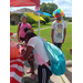 Kids at the snack table getting a drink.