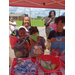 Kids getting snacks at the snack table.