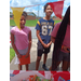 Kids standing by a table at the Back to School Bash.