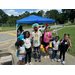 People at the Back to School event getting school supplies.