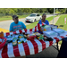 People sitting at the Back to School bash for the Garysburg Community.