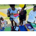 People with school supplies at the Back to School Bash.