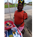 Young Lady standing by a table with school supplies.