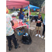 People getting snacks at the school supply giveaway.