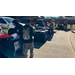 A bunch of people outside at the trunk or treat event.