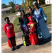 A group of people dressed up in costumes.