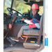 A smiling child in a fire truck.