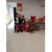 A couple young ladies sitting with Santa.