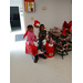 Santa with a couple kids at the Cookie and cocoa event.