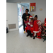 Santa with a lady and three kids.