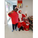 Smiling Lady with seated Santa.