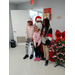 Three young ladies with Santa.