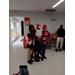 Santa standing with two older kids.